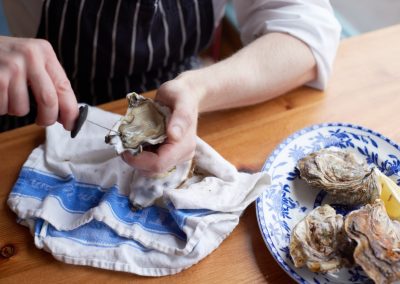 Oyster shucking by Ed Schofield
